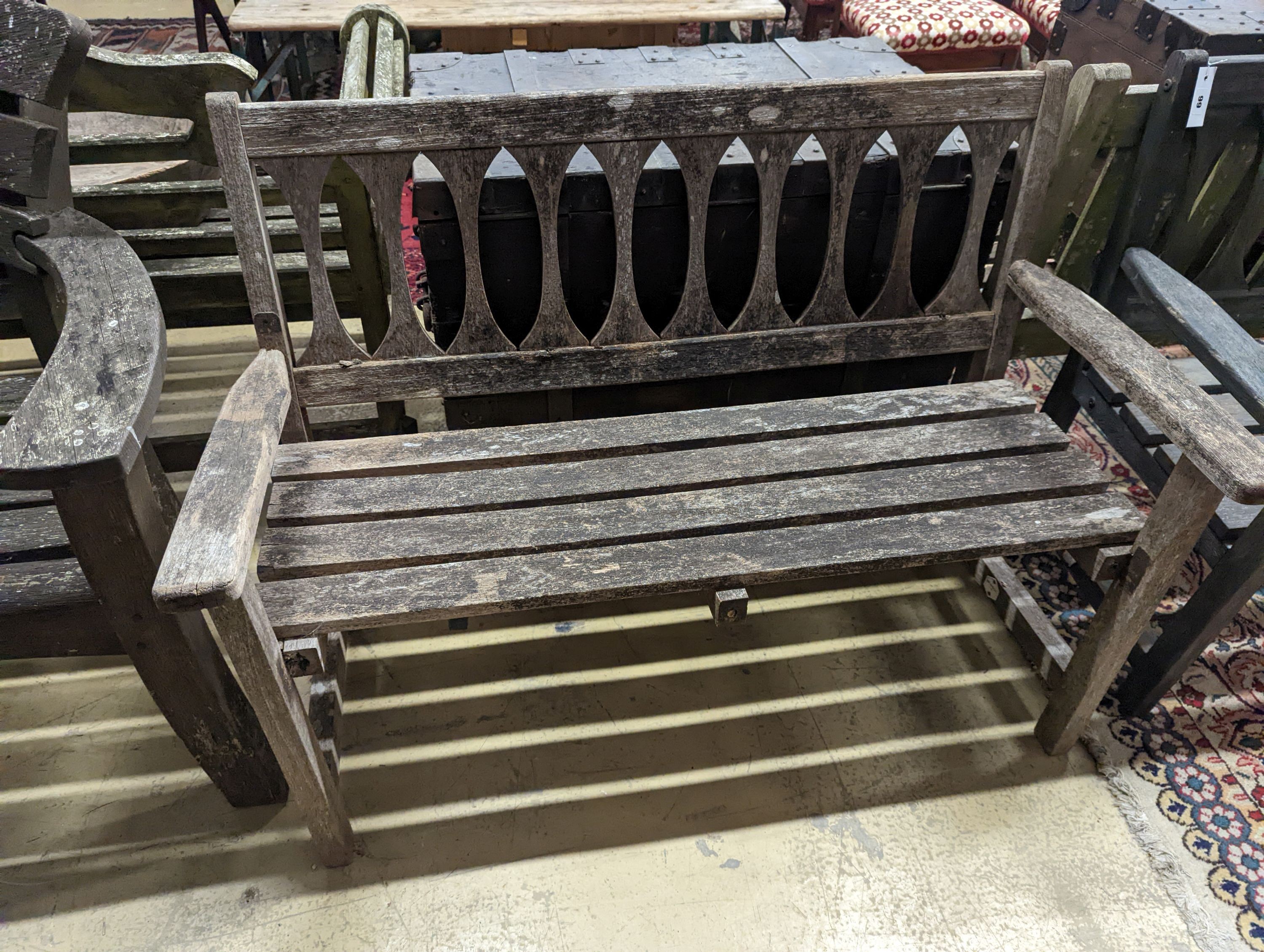 A pair of weathered teak garden benches, length 110cm, depth 50cm, height 83cm